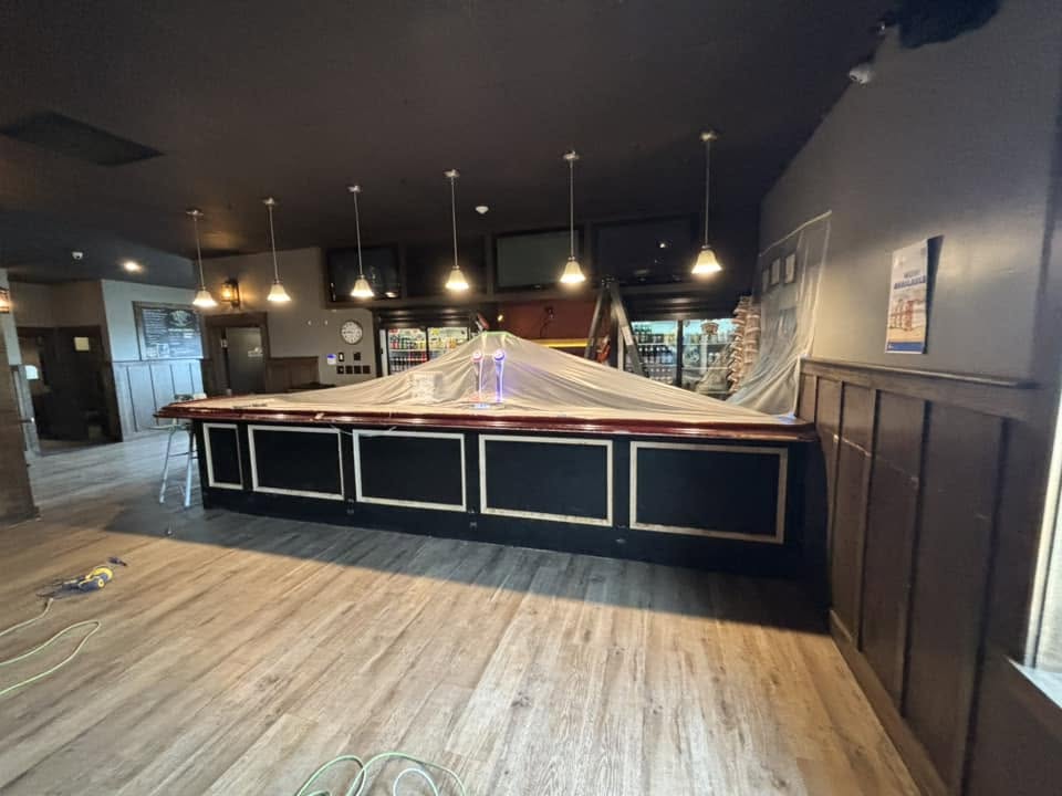 Lounge bar interior repainted with a bold dark finish