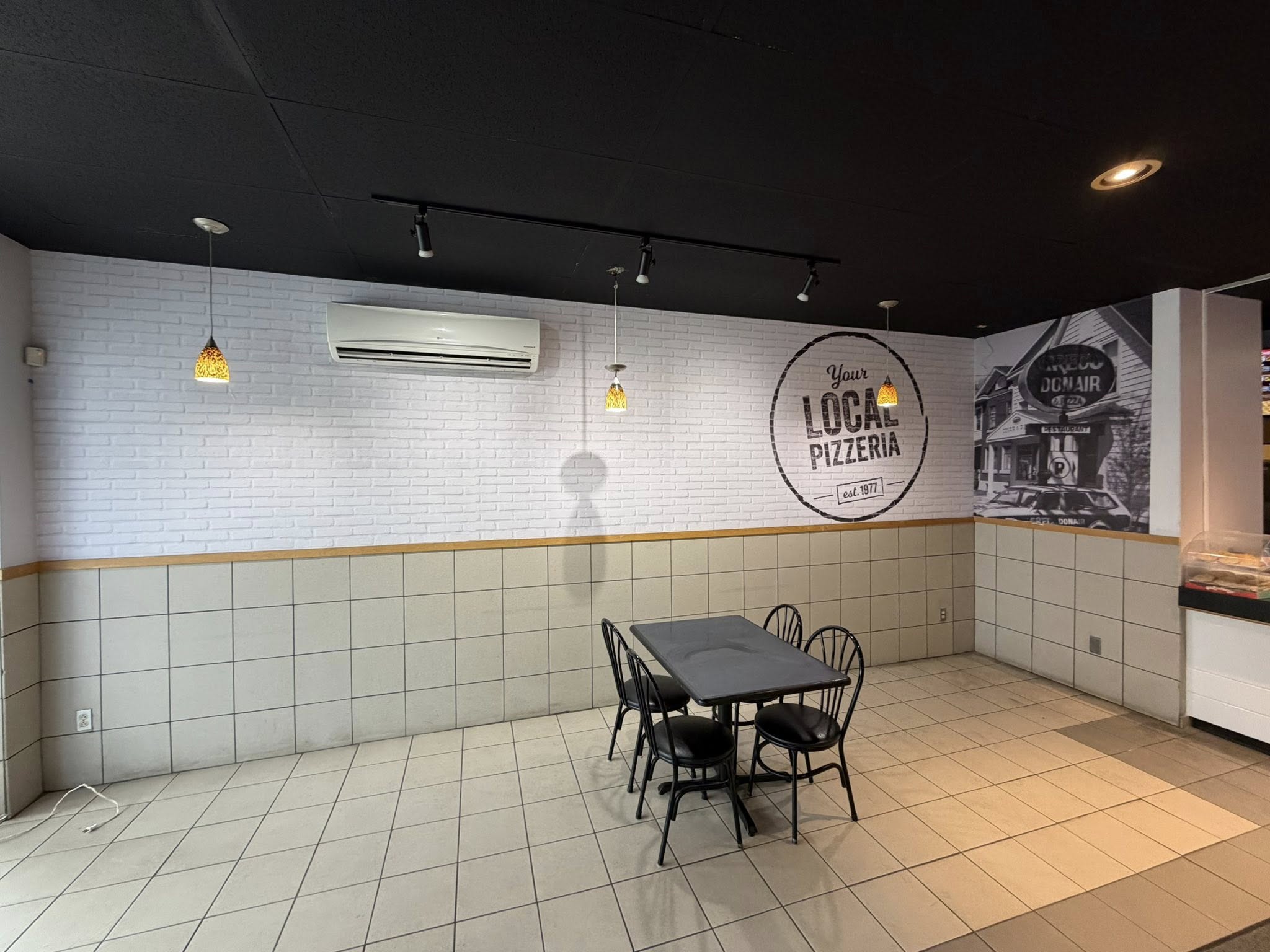Restaurant dining area with new brick-look feature wall