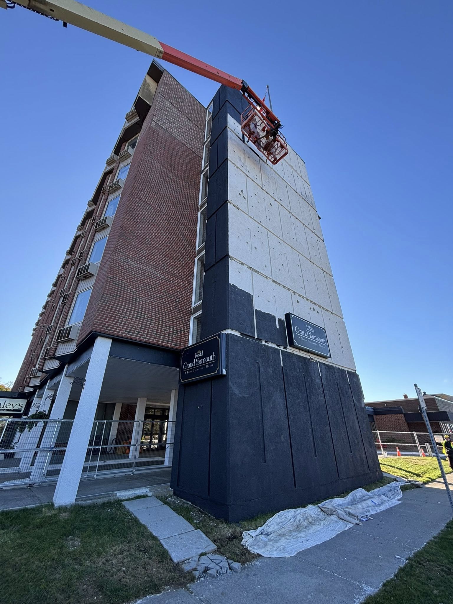 Multi-storey hotel tower with patched, unfinished exterior