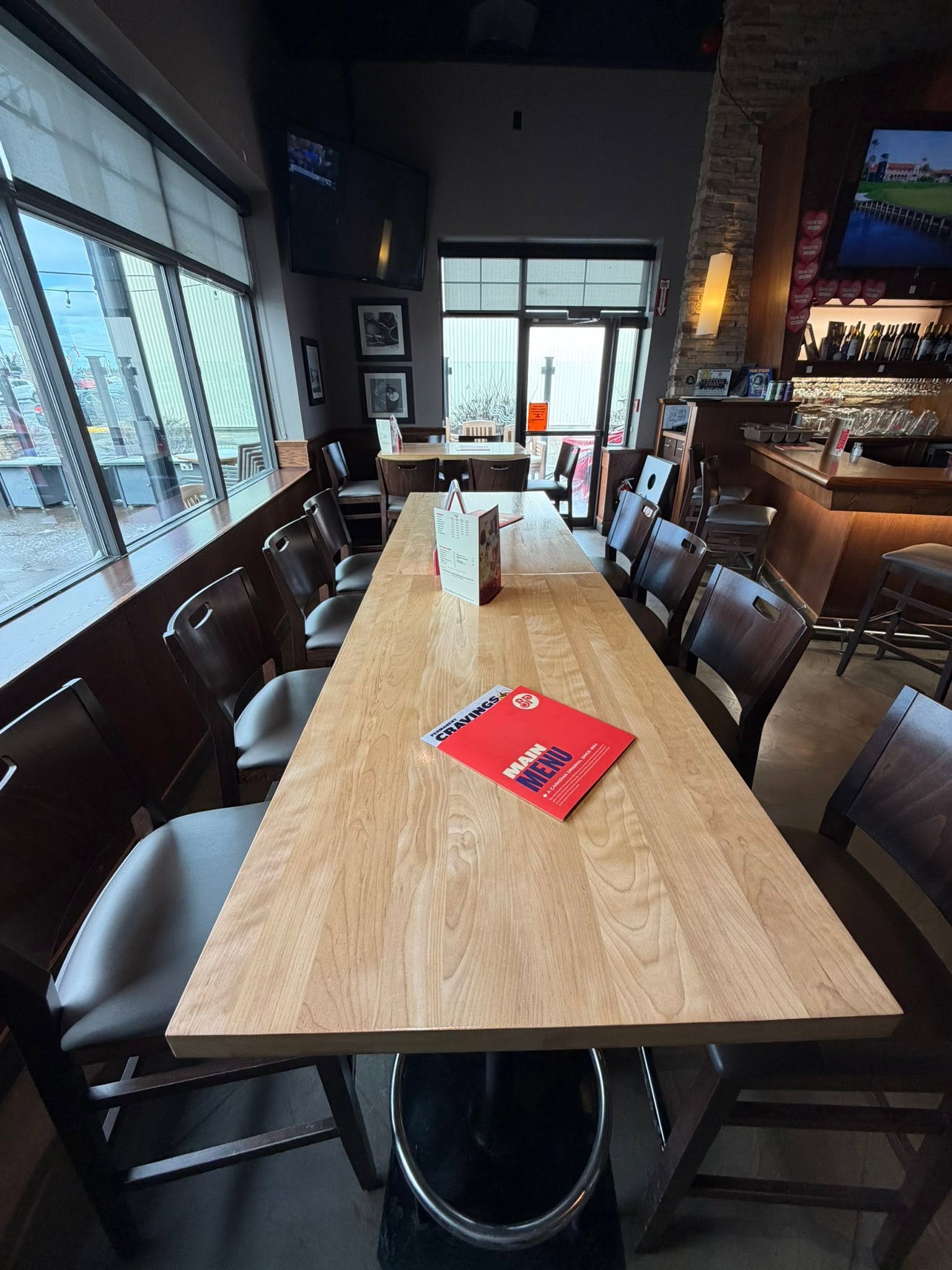 Restaurant table refinished with a smooth natural wood finish