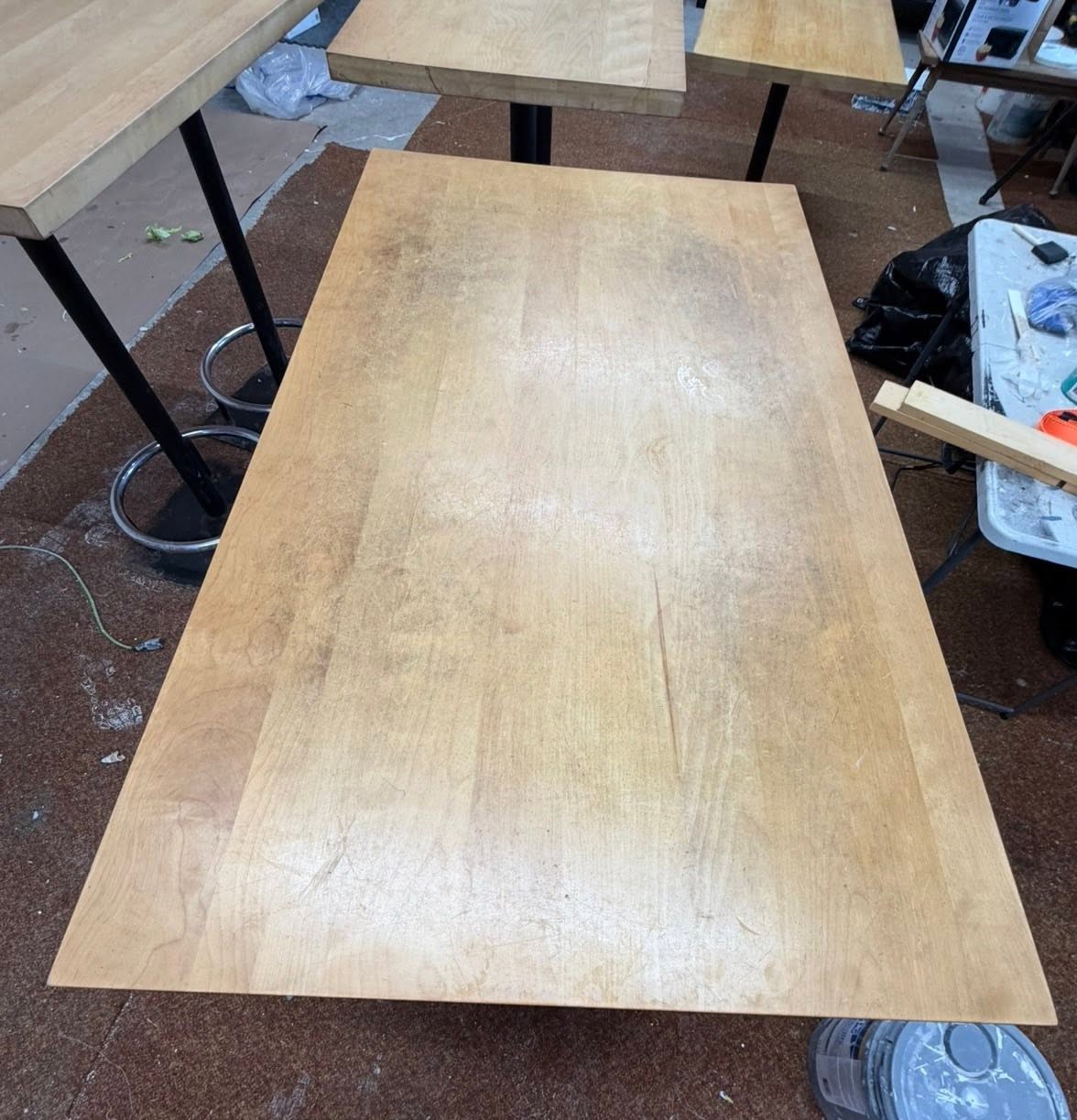 Worn, scratched restaurant tabletop before refinishing