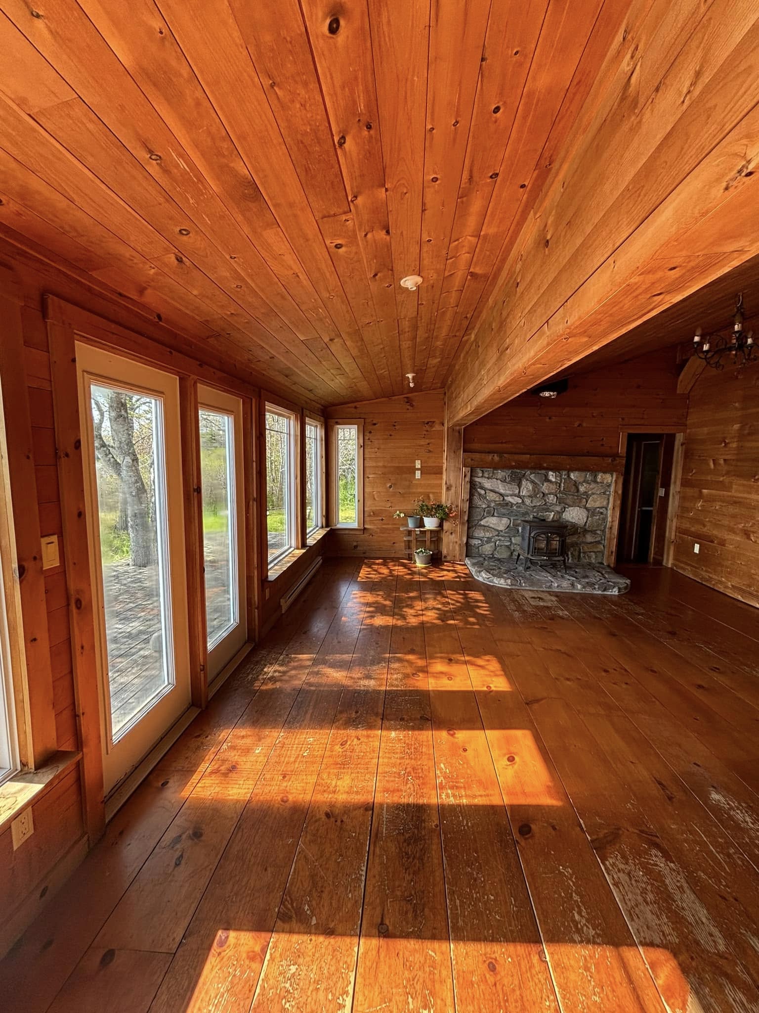 Knotty-pine sunroom before painting