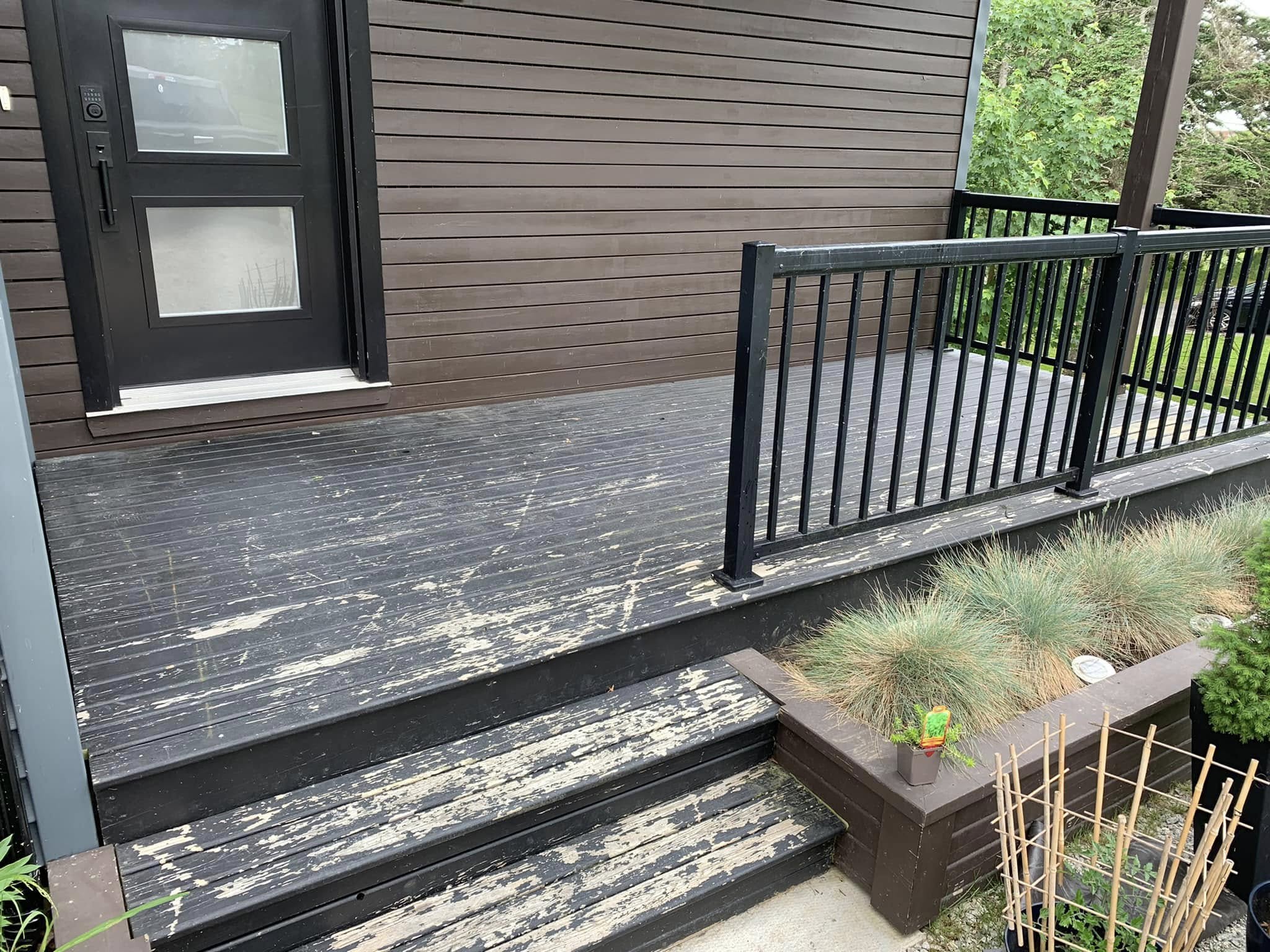 Weathered deck with heavily peeling stain before restaining